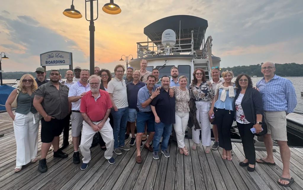 EEI Members on a dock at sunset coming from a group boat trip